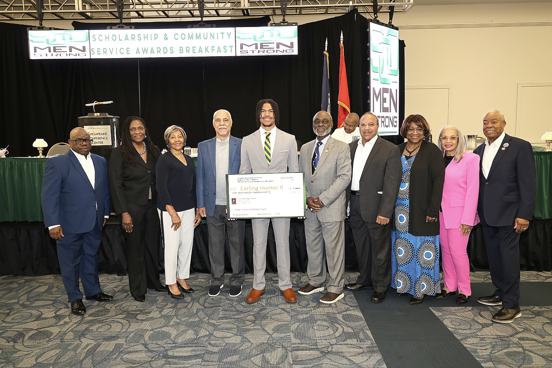Foundation and community leaders supporting a scholarship recipient